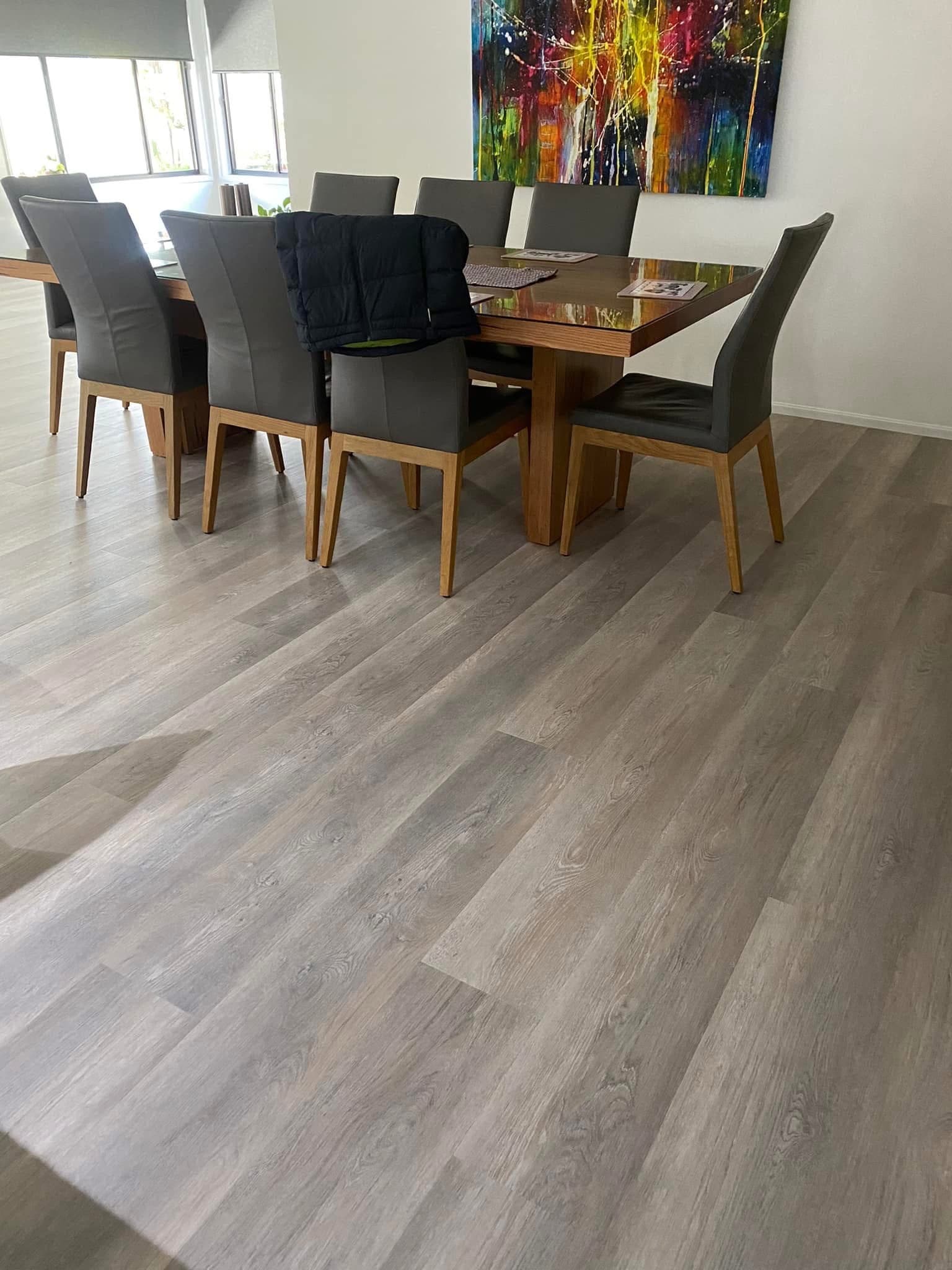 Wide view of dining room with new light grey-oak vinyl plank flooring — Lambton
